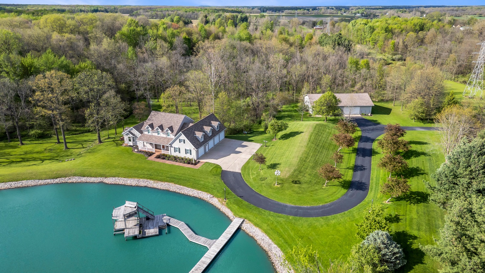 Estate aerial with private pond